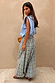 Blue Check Balloon Trousers featuring a relaxed draped silhouette, styled with a blue striped sleeveless top.