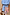 Thumbnail for Minigonna asimmetrica a quadri con dettaglio a righe blu annodato in vita e top coordinato.