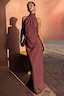 Chocolate Daphne Skirt and halter neck top co-ord with a high-waisted fit in a sunlit setting.