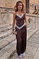 Chocolate satin wide-leg trousers with blue lace trim and matching cami top, shown on a model on outdoor stone steps.