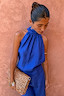 Thumbnail for Cobalt Billie Top featuring a high halterneck and soft gathered neckline, styled with a leopard print clutch.