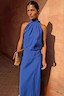 Cobalt Billie Top with a high halterneck and front gathers, styled with a matching skirt in a sunlit setting.