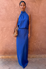 Vibrant Cobalt Daphne Skirt and matching halter top co-ord, styled on a model against a textured wall.