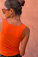 Coral Scoop Neck Rib Tank in a soft ribbed fabric, featuring a tonal embroidered NFD logo on the upper back.