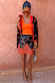 Coral Scoop Neck Rib Tank in soft stretch rib, styled with a patterned lace trim mini skirt and draped cardigan.