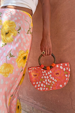 Coral Fawn Beaded Bag with iconic poppy and deer print in glass bead embroidery, featuring a circular wooden handle.