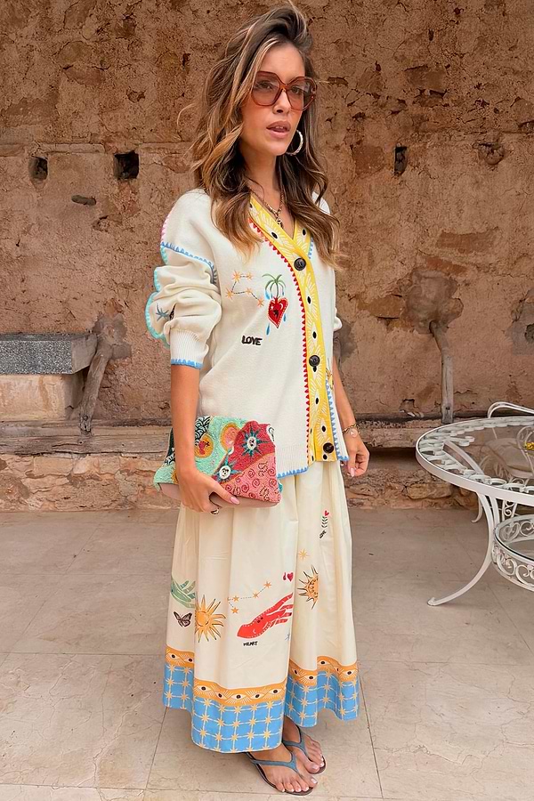 Cream Celestial Martha Cardigan in a soft touch knit with celestial motifs and a yellow hem, designed in London.