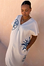 Thumbnail for Cream cotton Dolce Vita T-Shirt Dress with blue hand-painted sun motifs and side pockets, designed in London.