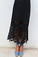 Black Star Sasha Dress featuring a sheer star lace hem and lace cut out details, paired with blue espadrilles.
