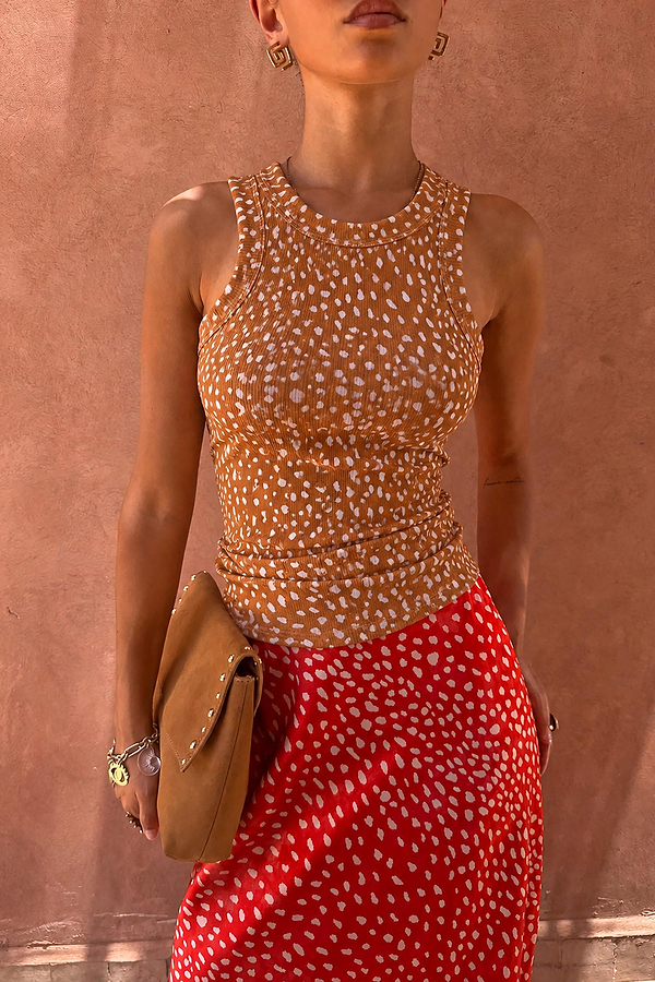 Fawn Rib Tank Top in an ochre animal print with white spots, featuring a high neck and textured ribbed finish.