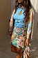 Star Beaded Dreamer Mini Skirt with hand-embroidered pastel motifs, styled with a blue top and knit cardigan.