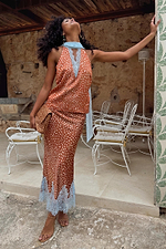 Fawn print Midi Maeva Skirt with light blue lace trim, styled as a matching co-ord on an outdoor terrace.