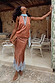 Fawn print Midi Maeva Skirt with light blue lace trim, styled as a matching co-ord on an outdoor terrace.