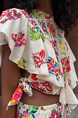 Cream Fruit Stamps Florence Top with a Mediterranean fruit print, asymmetric ruffles, and side tie detailing.