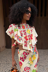 Fruit Stamps Florence Top in cream cotton-linen with Mediterranean fruit prints, asymmetric ruffles and side ties.