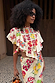 Fruit Stamps Florence Top in cream cotton-linen with Mediterranean fruit prints, asymmetric ruffles and side ties.