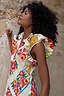 Thumbnail for Fruit Stamps Remi Dress with ruffle sleeves and a bold fruit sticker print in a breathable cotton linen blend.
