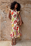 Fruit Stamps Remi Dress in a cotton-linen blend with a bold fruit sticker print and ruffle sleeves.