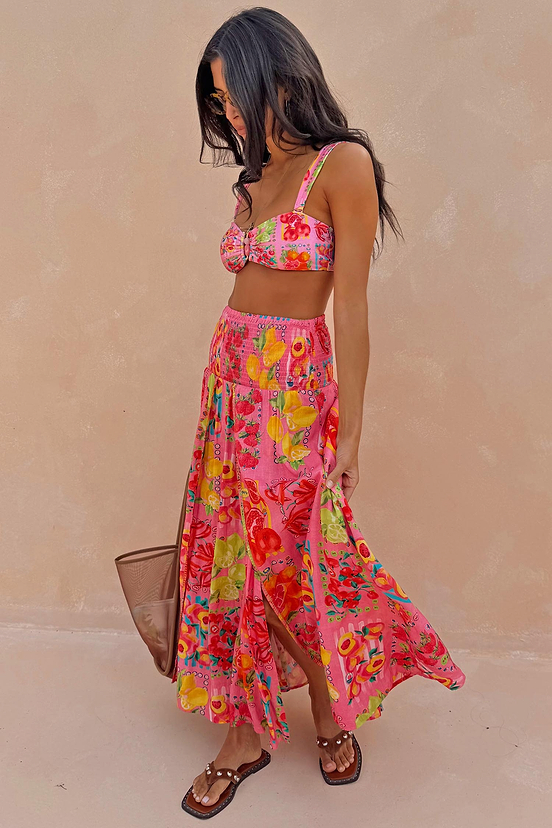Pink Fruit Stamps Skirt featuring a Mediterranean fruit print, shirred waistband and side split detail, styled for vacation.
