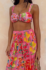 Pink Fruit Stamps Skirt with a Mediterranean fruit print and shirred waistband, paired with a matching bikini top.