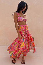 Pink Fruit Stamps Skirt with a Mediterranean fruit print, shirred waistband and side split for a vacation look.