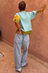 Geometric Palm Cardigan with blue and green colour-blocking and palm motifs, styled with light wash jeans.