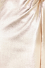 Close-up of the textured metallic gold vegan leather fabric on the iconic Jaspre wrap skirt.