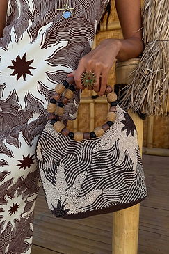 Soleil Beaded Bag in chocolate and cream sun print with hand-embellished beads and circular raffia and wooden handles.