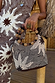 Soleil Beaded Bag in chocolate and cream sun print with hand-embellished beads and circular raffia and wooden handles.