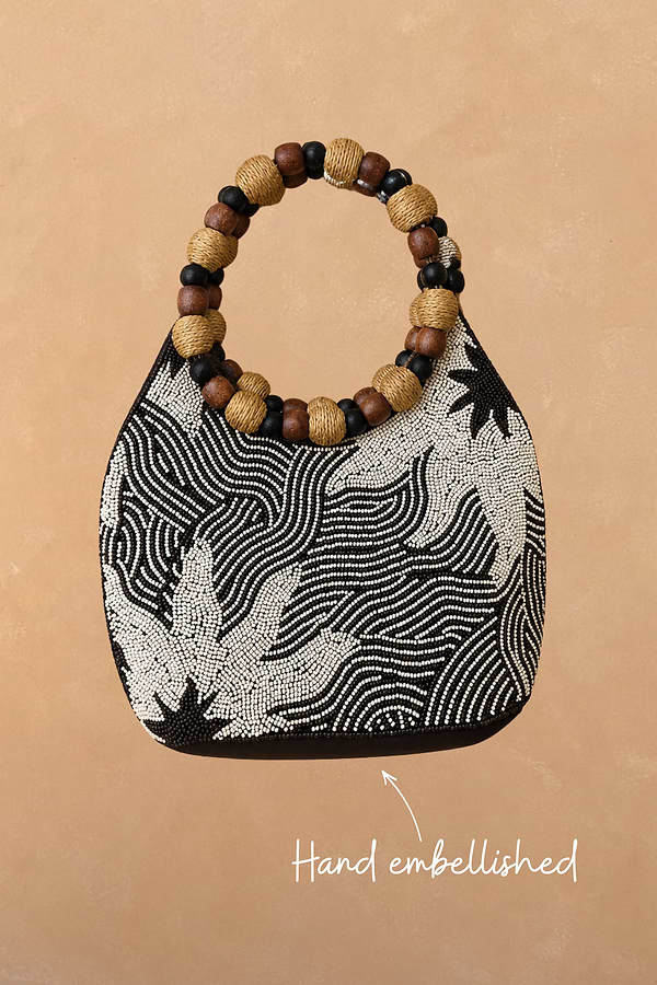 Soleil Beaded Bag in chocolate and cream with a hand-embellished soleil print and circular raffia and wooden handles.
