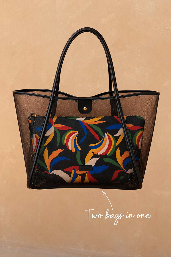 Black mesh tote bag with leather straps and a detachable multi-coloured banana print pouch inside.