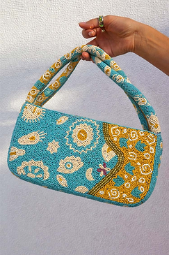 Blue and yellow Morocco beaded bag featuring hand-embellished glass beads and gold NFD motifs.