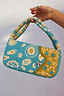 Blue and yellow Morocco beaded bag featuring hand-embellished glass beads and gold NFD motifs.