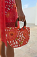 Coral Fawn Beaded Bag with intricate glass bead poppy and fawn motifs, complete with circular wooden handles.