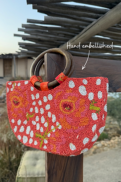 Coral Fawn Beaded Bag with hand-embellished glass bead poppy and deer motifs and circular wooden handles.