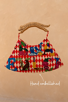 Cirque Bag with red diamond checks, hand-beaded alphabet motifs and a carved wooden animal-shaped handle.