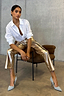 Thumbnail for Gold Vegan Leather Trousers styled with a white shirt and heels for a statement street style look.