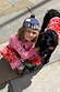 Kids Red and Pink Bandana Knitted Set worn by a child crouching next to a dog in a matching jumper.