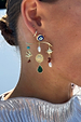 Gold Plated Balearic Charm Earring with turquoise, pearls and iconic motifs, styled on a model's ear.