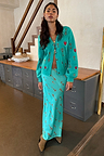 Turquoise Key Dorris Skirt in viscose with a hand-painted key and lock print, paired with its matching cardigan.