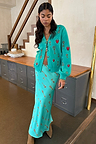 Turquoise Key Dorris Skirt with a hand painted key print, paired with a matching embroidered cardigan for a London look.