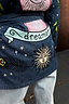 Thumbnail for Blue denim jacket featuring embroidered tarot-inspired motifs, a dreamer banner, and sun detail on the back.