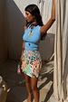 Ice Blue Ribbed Tank Top in a soft stretch fabric, a capsule wardrobe staple paired with a colourful mini skirt.