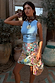 Ice Blue Ribbed Tank Top styled with a beaded star print mini skirt and matching bag in a rustic outdoor setting.
