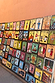Thumbnail for Vibrant hand-painted folk art signs on a wall depicting characters and professions in Marrakech.