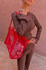 Chocolate stripe ribbed top with bra detail and flared sleeves, paired with matching trousers and a red mesh bag.