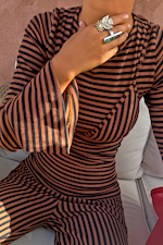 Chocolate and black stripe ribbed top with layered bra detail, flared sleeves and matching trousers.