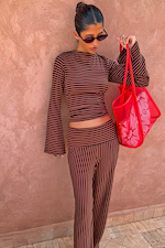 Fold Over Pants in Chocolate Stripe and matching long sleeve top in ribbed fabric, styled with a red mesh bag.