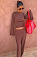 Fold Over Pants in Chocolate Stripe and matching long sleeve top in ribbed fabric, styled with a red mesh bag.