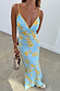 Blue Fawn Poppy Elsie Dress with yellow poppy print and white spots on a bias-cut slip silhouette.
